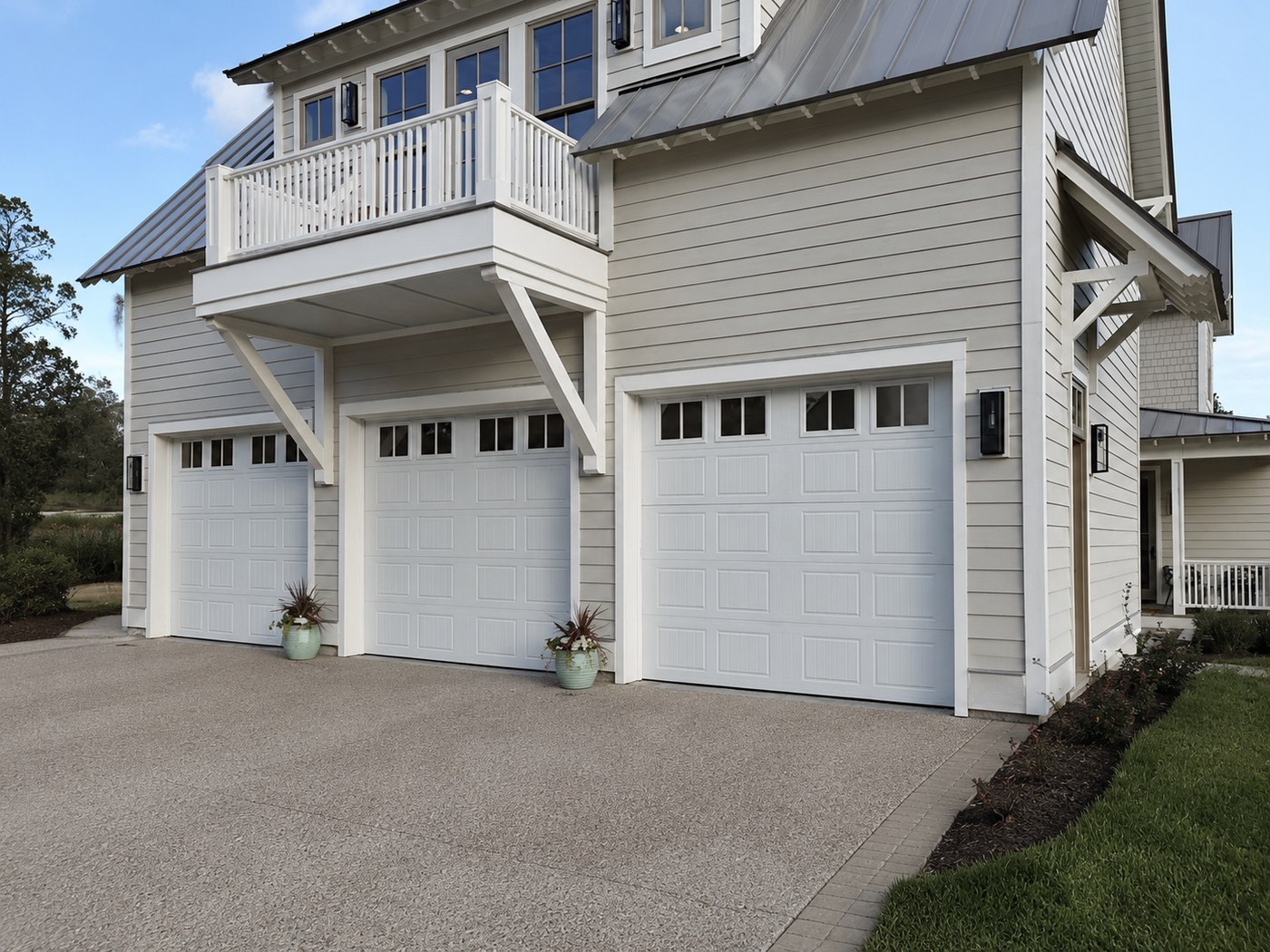 Classic raised-panel steel garage door on a traditional Bay Area home