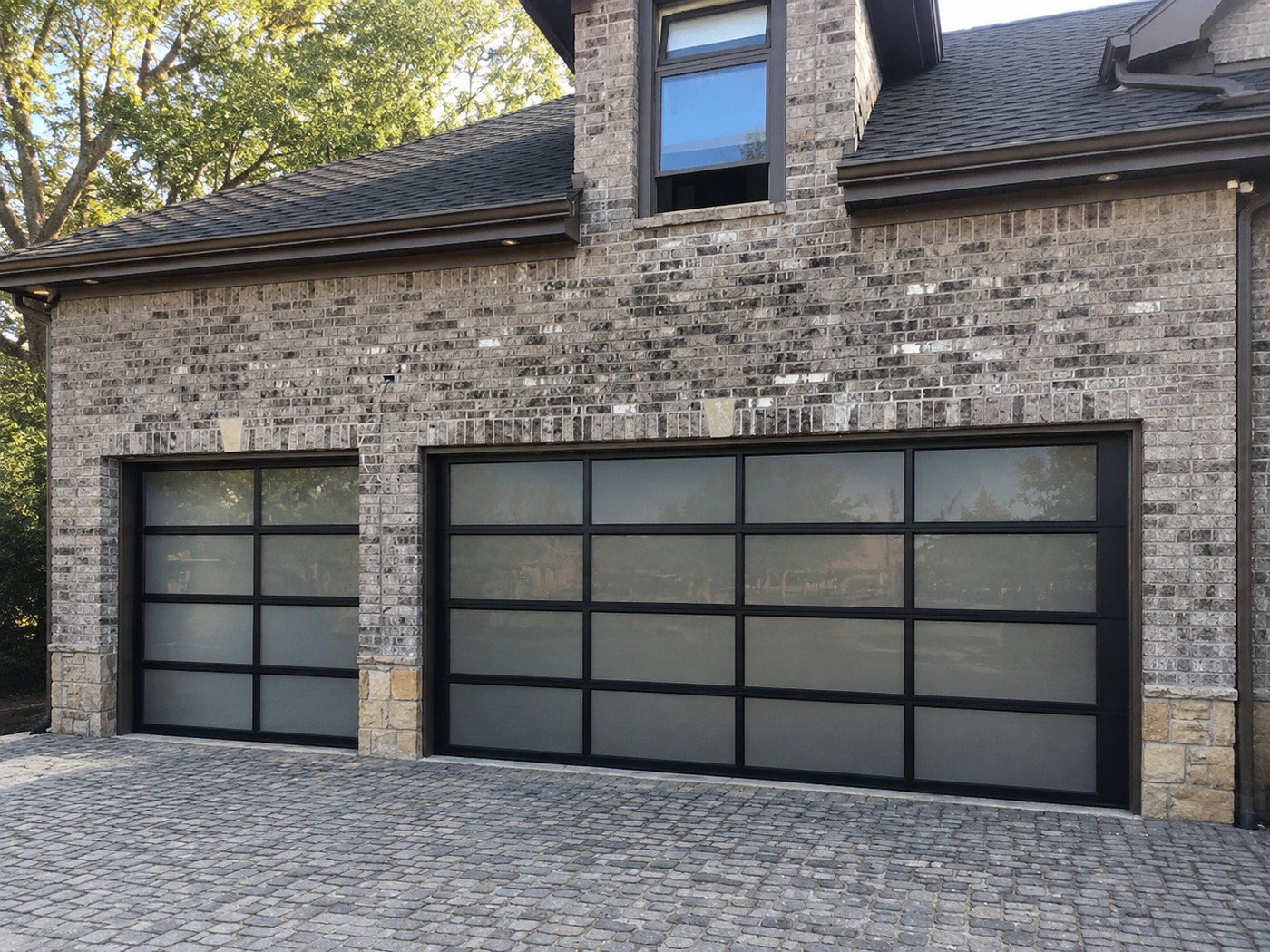 Dual full-view aluminum glass garage doors brick home Bay Area installation